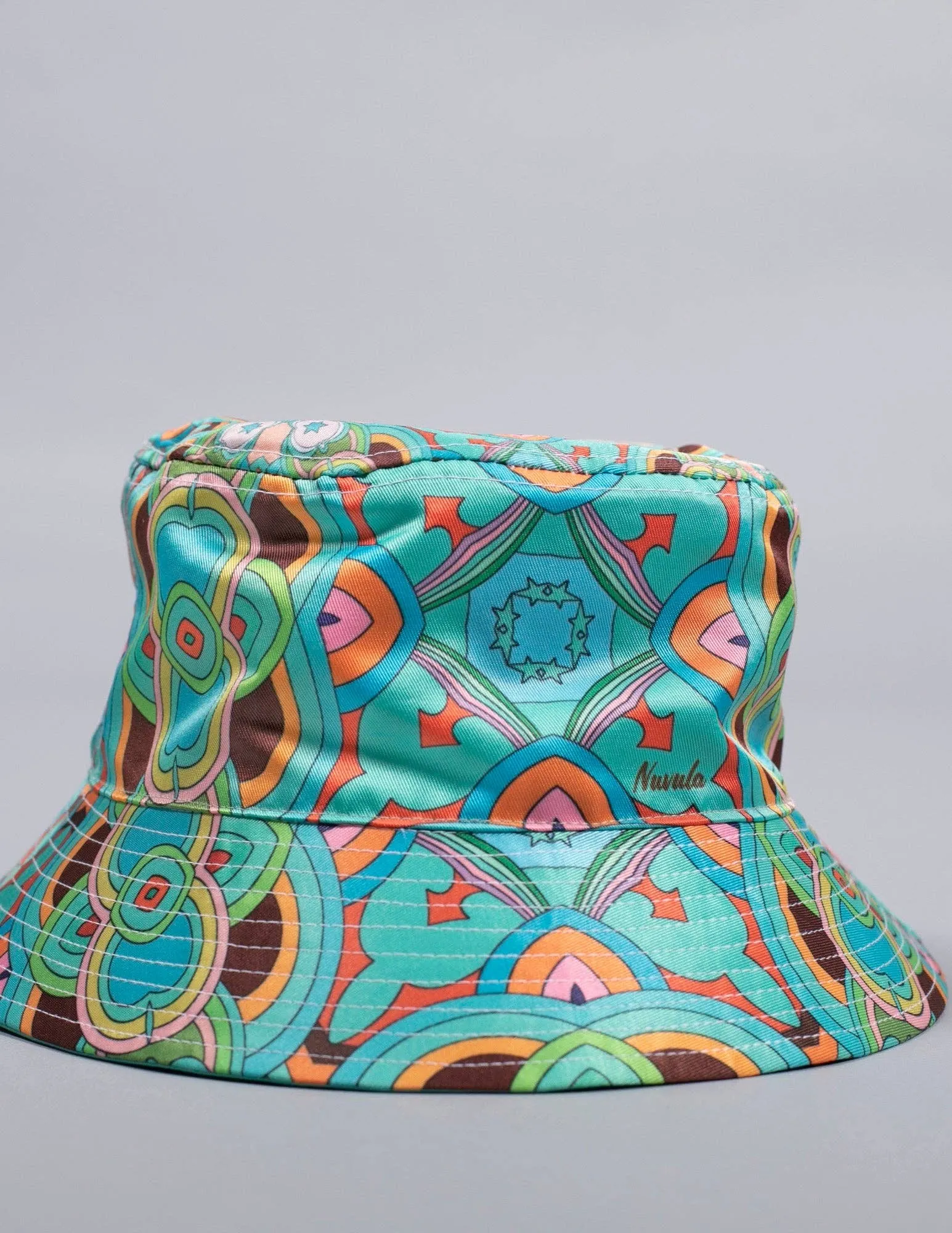 PSYCHEDELIC CROSSES AND STARS TEAL BUCKET HAT