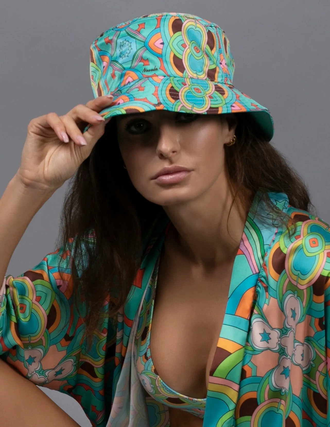 PSYCHEDELIC CROSSES AND STARS TEAL BUCKET HAT